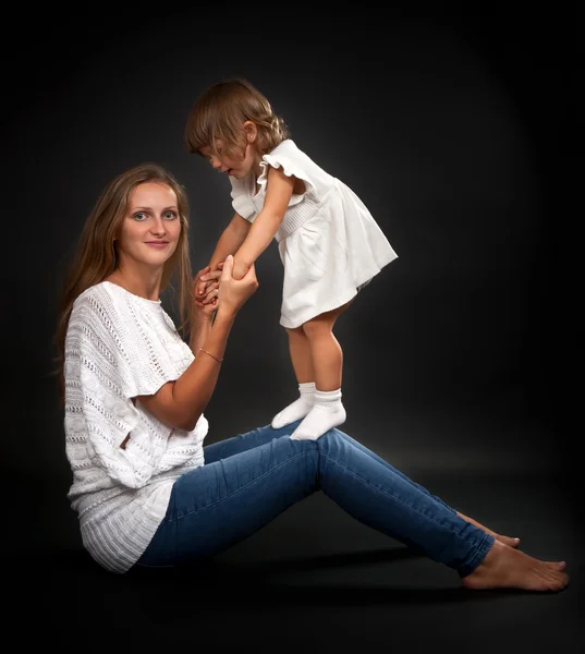 Mom and baby daughter in the studio — Stock Photo, Image