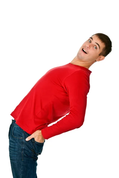 Flexible man in red clothes and jeans — Stock Photo, Image
