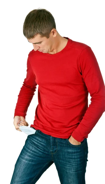 Man looks with interest at his empty pocket — Stock Photo, Image