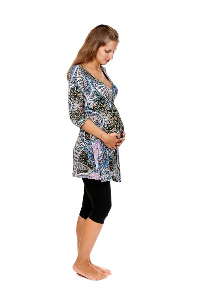 Mulher grávida em perfil no estúdio — Fotografia de Stock
