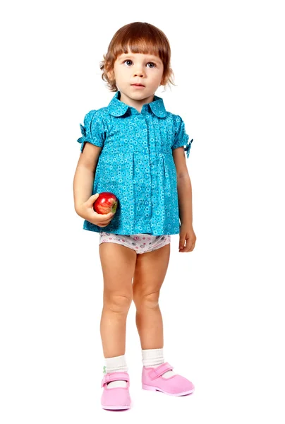 Dziewczynka z jabłkiem w studio na białym tle — Zdjęcie stockowe