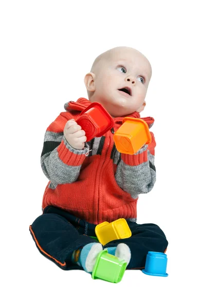 Little boy with a plastic pyramid in the studio — Stock Photo, Image