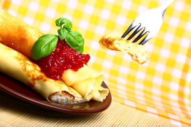 Sweet pancake with cottage cheese and cherry jam