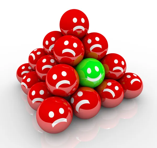 Happy Smile Face in Ball Pyramid of Sad Faces — Stock Photo, Image