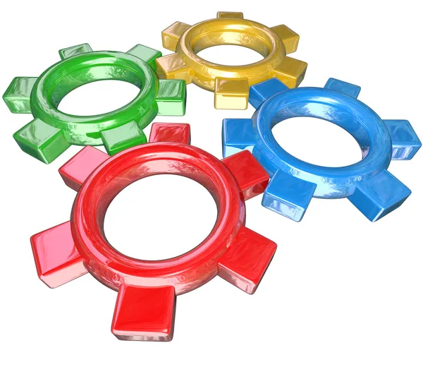 Négy színes fogaskerekek, esztergálás együtt, kórusban - synerg csapatmunka — Stock Fotó