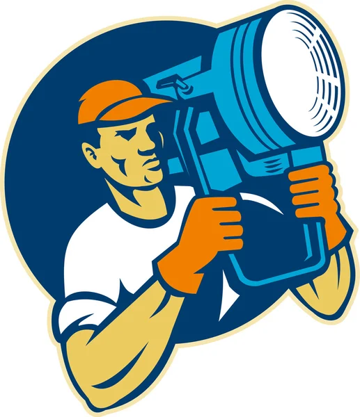 Film lighting crew holding a spotlight — Stock Photo, Image