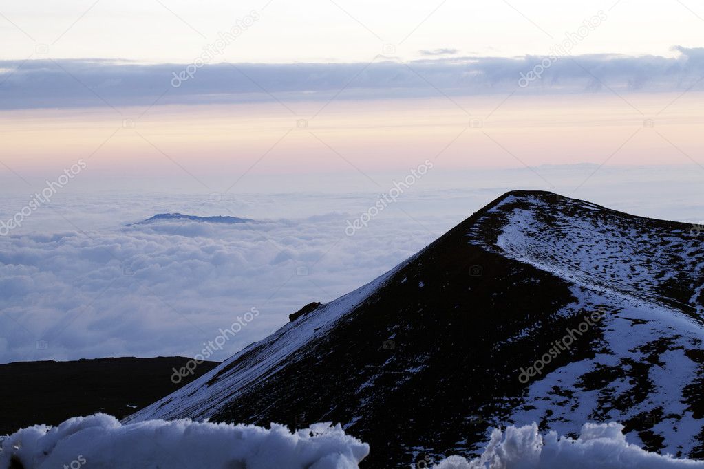 Volcano cone with snow and clouds horizontal