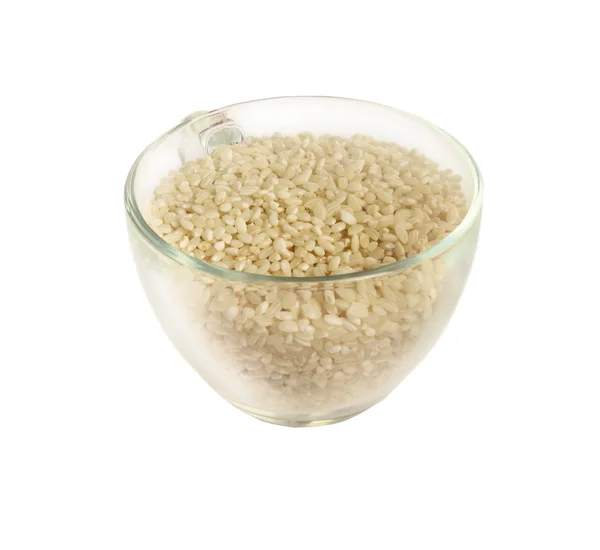 Glass cup with rice groats — Stock Photo, Image