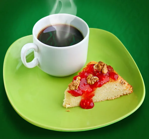 A cup of coffee with cheese cake