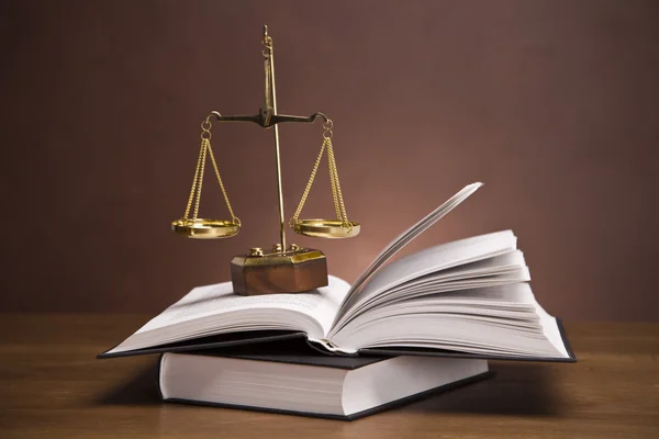 stock image Scales of justice and gavel on desk with dark background