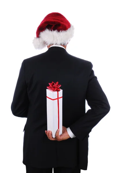 Businessman santa hat and present — Stock Photo, Image