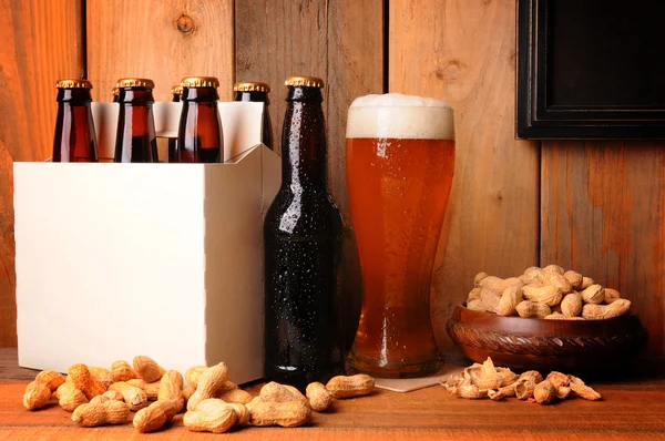 stock image Beer and Peanuts in Rustic Setting