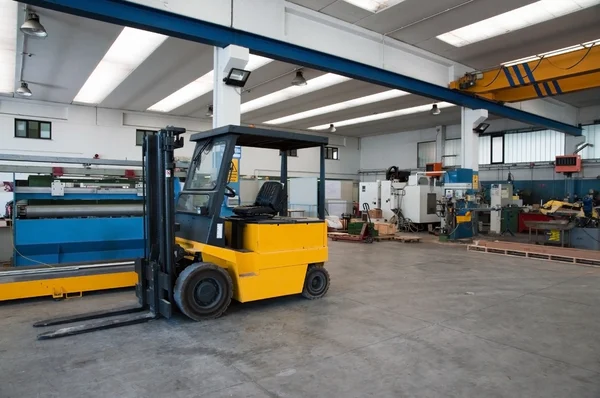Factory wharehouse with forklift — Stock Photo, Image