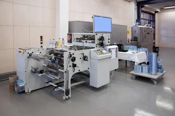 Shrink sleeve labeler machine. Stock Picture