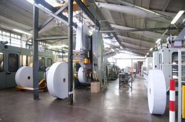 Factory - Machine to produce envelopes and bag clipart