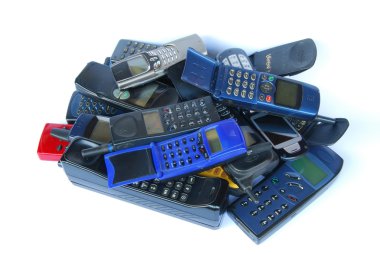 Old cell phones on white background clipart