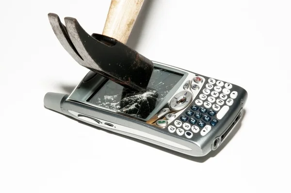 Cell phone - Hammer breaks a smartphone — Stock Photo, Image