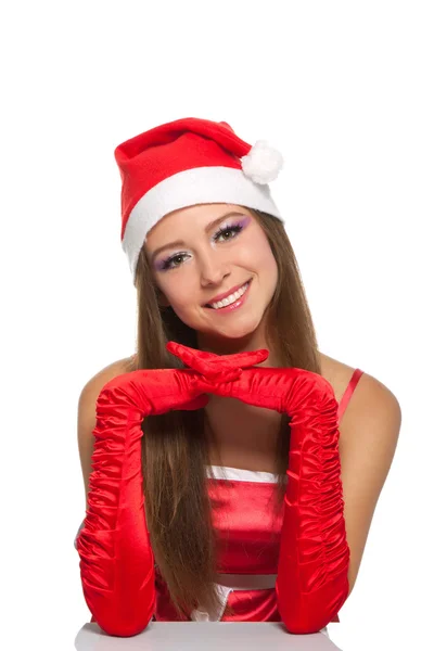 Weihnachtsmädchen mit rotem Weihnachtsmann-Hut — Stockfoto