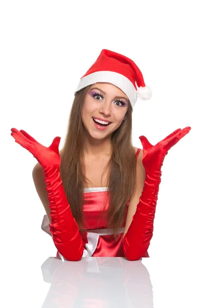 Різдвяна дівчина в червоному капелюсі Санта — стокове фото