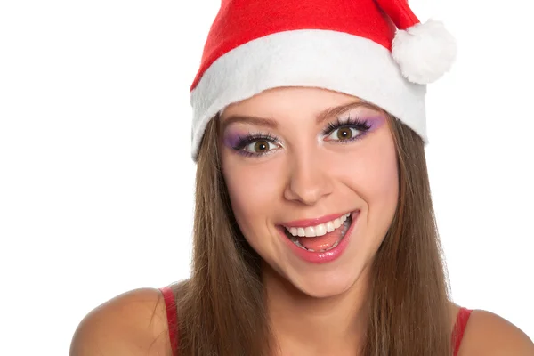 Різдвяна дівчина в червоному капелюсі Санта — стокове фото