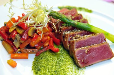 Half-roasted tuna with stewed vegetables clipart