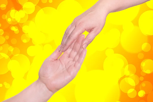 To håndflater på gul bakgrunn – stockfoto