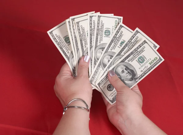 Доллары на красный — стоковое фото