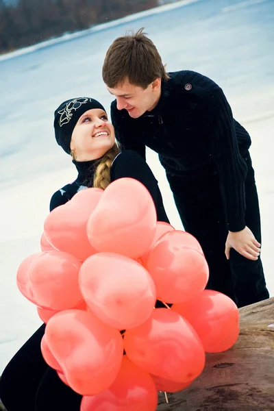Couple in love with balls — Stock Photo, Image