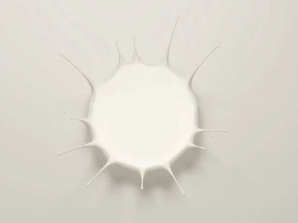 Salpicadura de leche sobre un fondo blanco — Foto de Stock