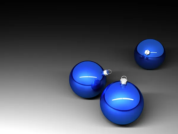 Três bolas de Natal azuis no fundo escuro — Fotografia de Stock