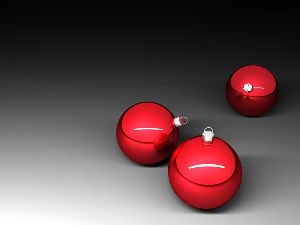 Three red christmas balls on dark background — Stock Photo, Image