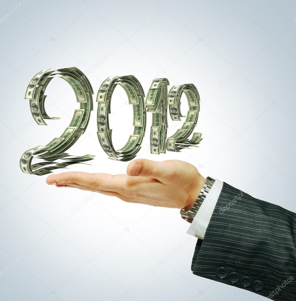 2012 sign on businessman's hand