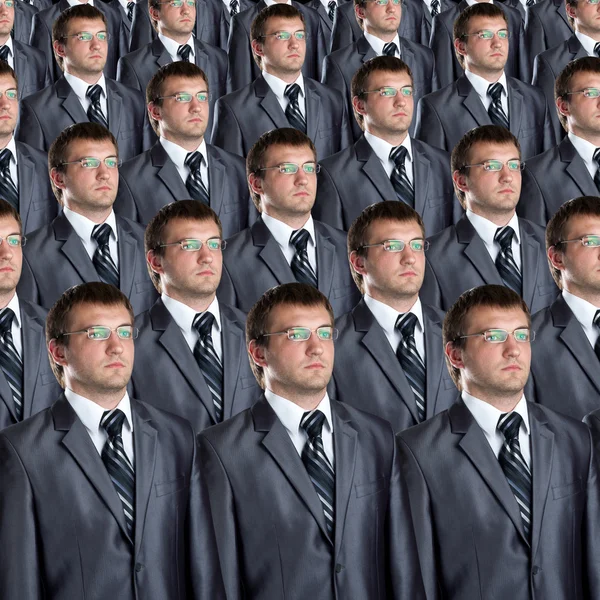 Muitos clones de empresários idênticos — Fotografia de Stock