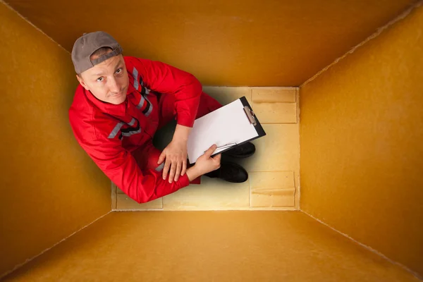 Courier inside empty box — Stock Photo, Image