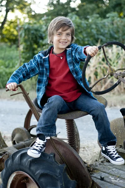 Boy with tractor — Stock Photo, Image