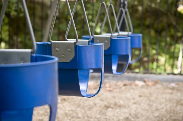 Kids playground swings — Stock Photo, Image