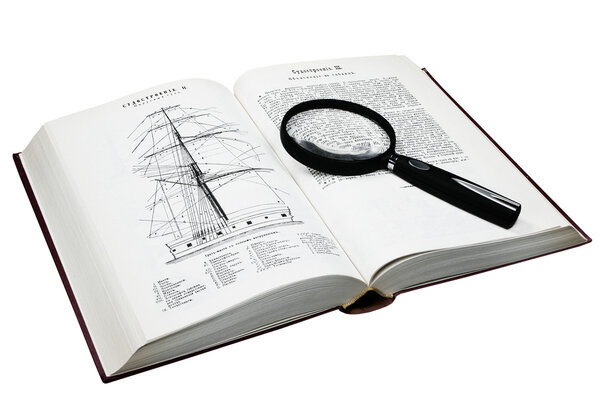 The opened book and magnifier