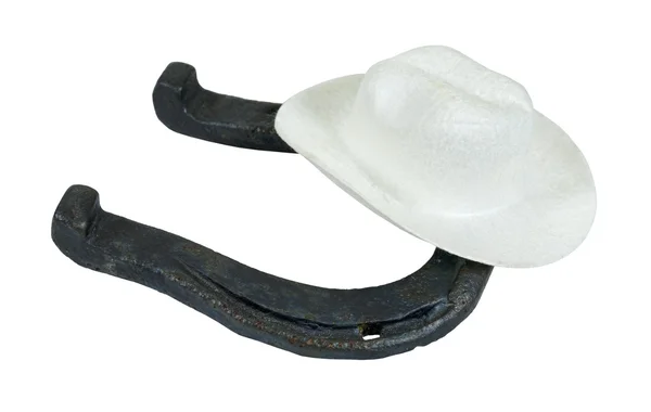 Chapéu de cowboy branco em uma ferradura de metal — Fotografia de Stock