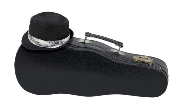 Fedora nera sulla custodia musicale con manico — Foto Stock