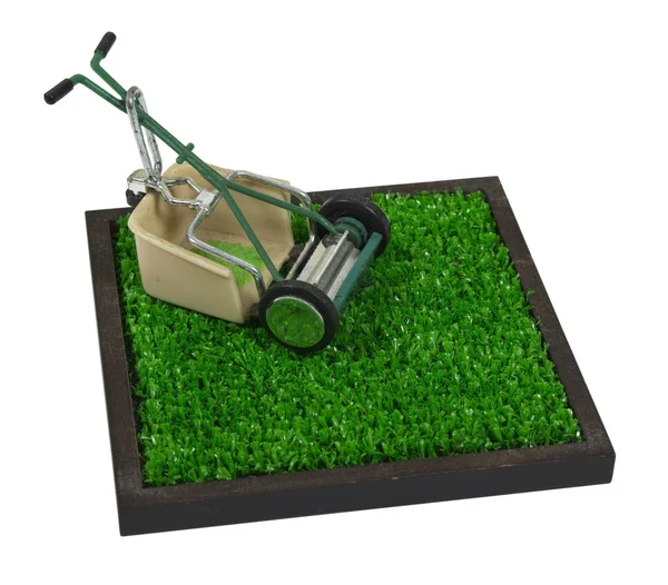 Retro gräsklippare på gräset — Stockfoto