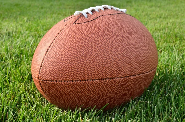 Close up of an American Football on Grass Field — Stock Photo, Image