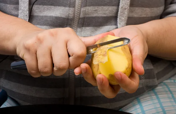 stock image Peeling potatoes