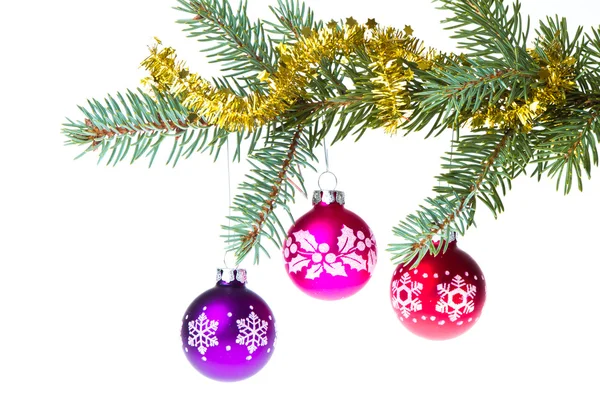 Christmas balls on spruce branch — Stock Photo, Image
