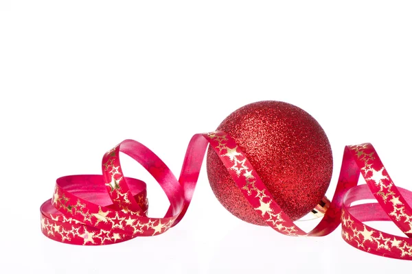 Red christmas ball with ribbon — Stock Photo, Image