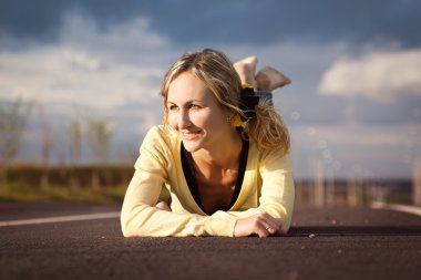 The girl lies on road clipart