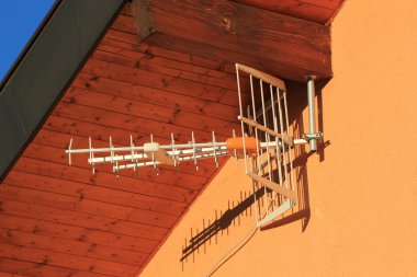 Antenna on house wall clipart