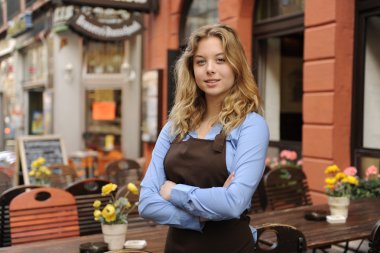 Waitress in front of restaurant clipart