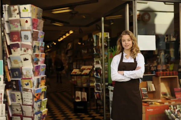 Store owner in front of shop — Stock Photo, Image