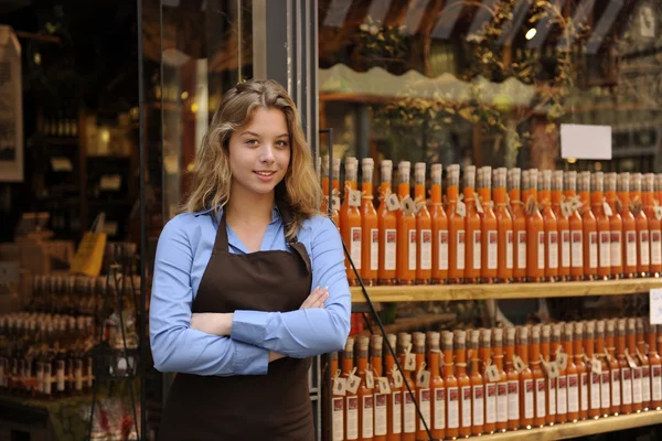 Store owner in front of shop — Stock Photo, Image