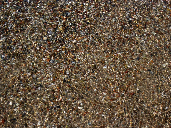 Stock image Sand and pebbles at the seashore